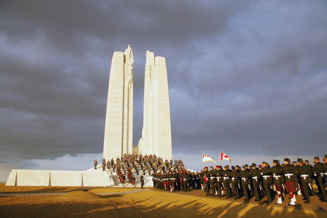 Vimy, FRANCE: Canadian soldiers parade in front of the Canadian memorial, 07 April 2007 in Vimy (northern France), to commemorate the 90th anniversary of the battle of Vimy Ridge, a painful World War I victory that firmed Canada's national identity. Almost 7.000 Canadians will travel to northern France on 09 April to commemorate the anniversary, that will be led by Canadian Prime minister Stephen Harper and his family, who will honor the memory of Canadian soldiers killed during the battle. A total 3,598 Canadian Corps troops were killed and 7,004 were wounded over four days of fighting as they seized control of the ridge from German soldiers.   AFP PHOTO PHILIPPE HUGUEN (Photo credit should read PHILIPPE HUGUEN/AFP/Getty Images)